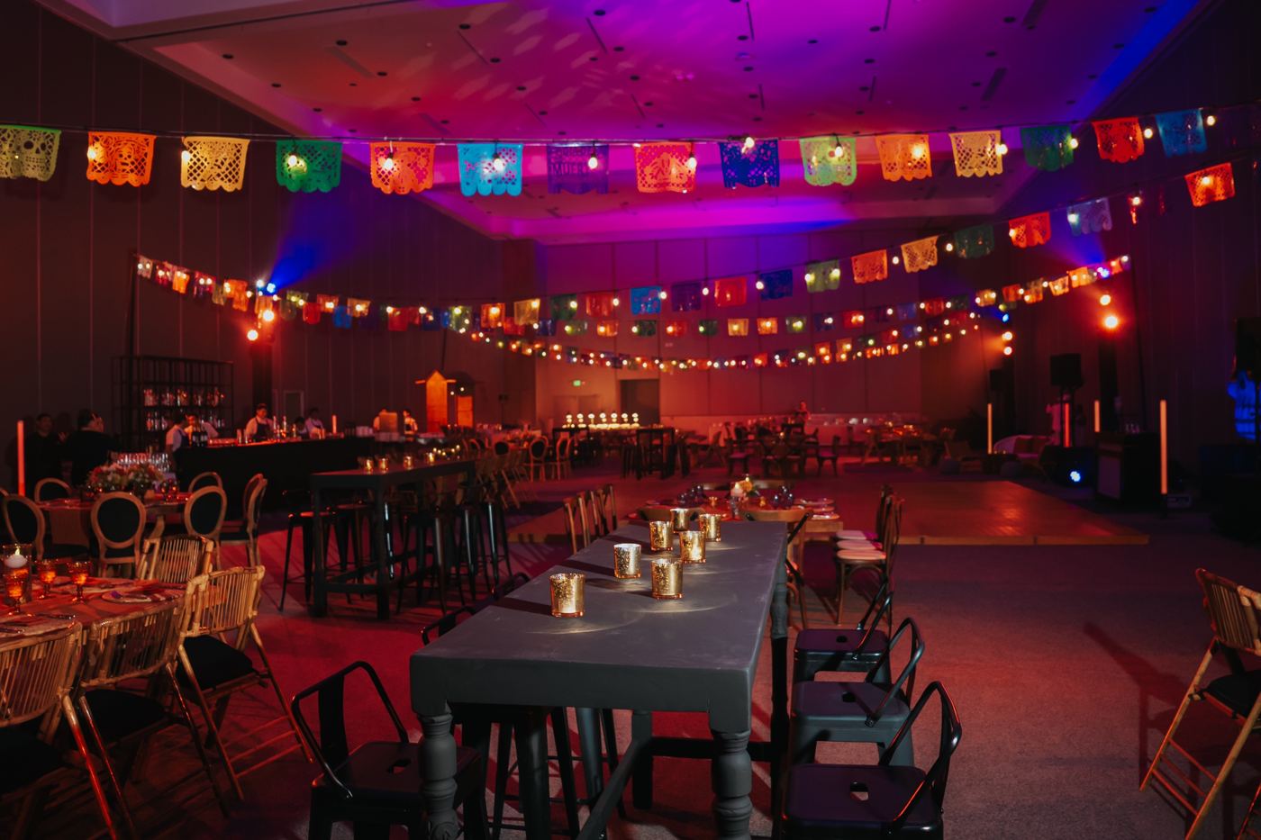 Reception hall strung with papel picado and string lights