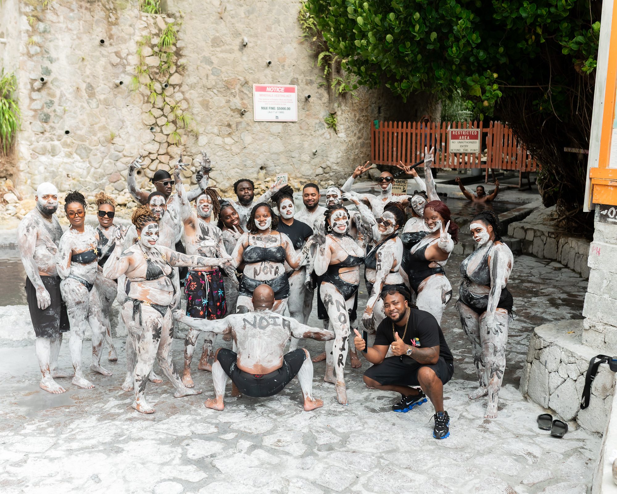 NOIR travelers covered in mud at the St. Lucia sulphur springs